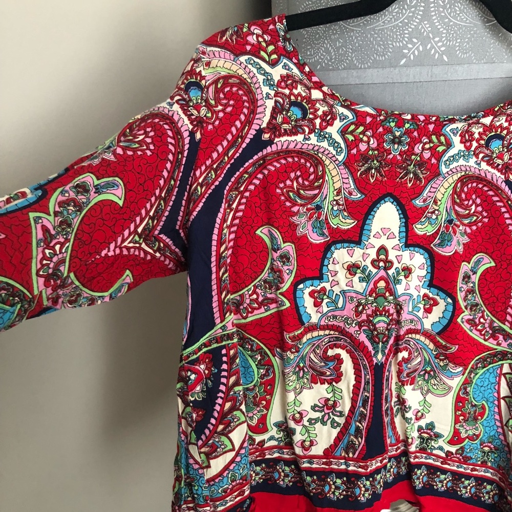 Francesca’s red blouse